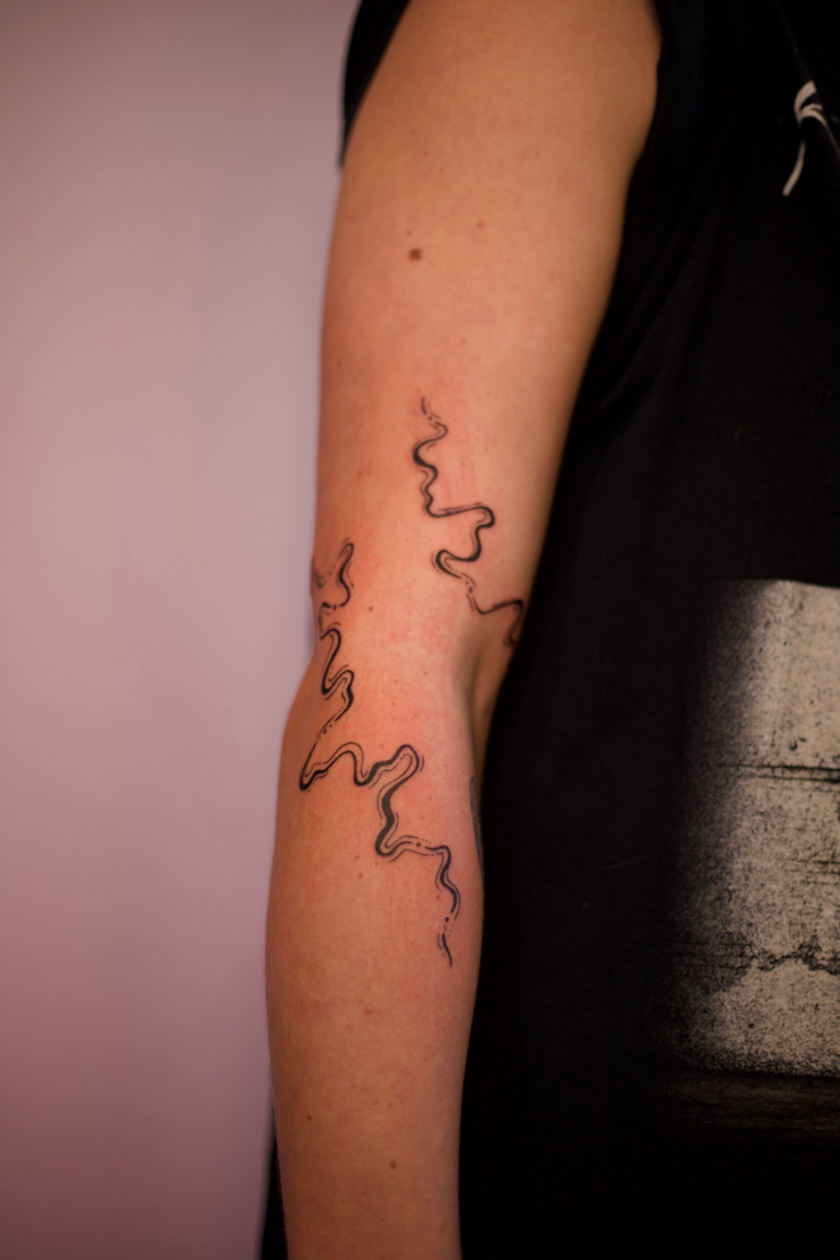 Freehand Swirly Elbow Wrap Tattoo
