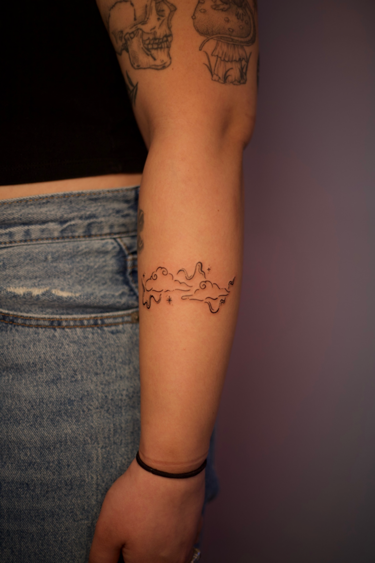 Clouds and Stars Swirly Forearm Tattoo