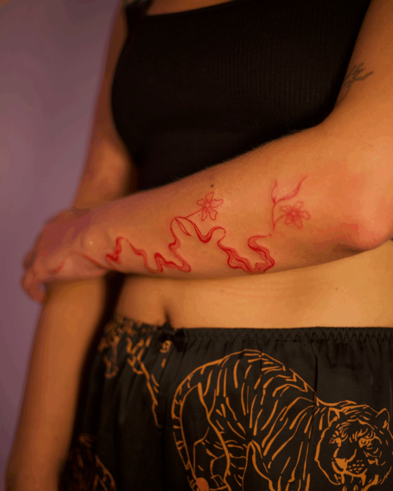 Red Ink Floral Swirly Forearm Tattoo