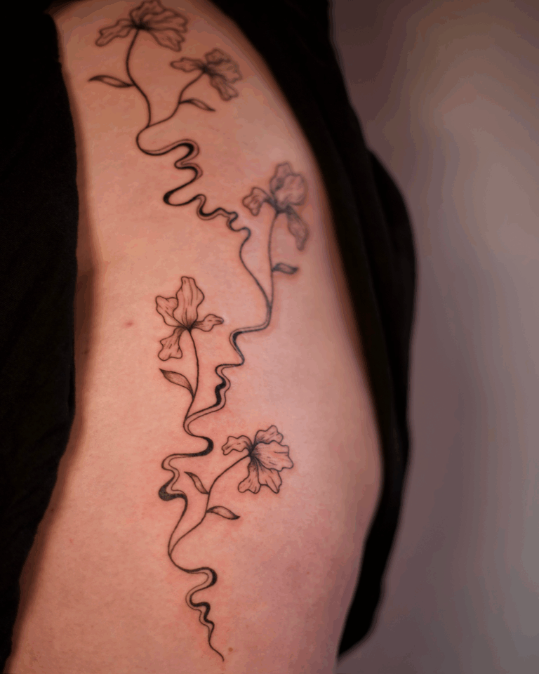 Swirly Lilies Sternum Tattoo